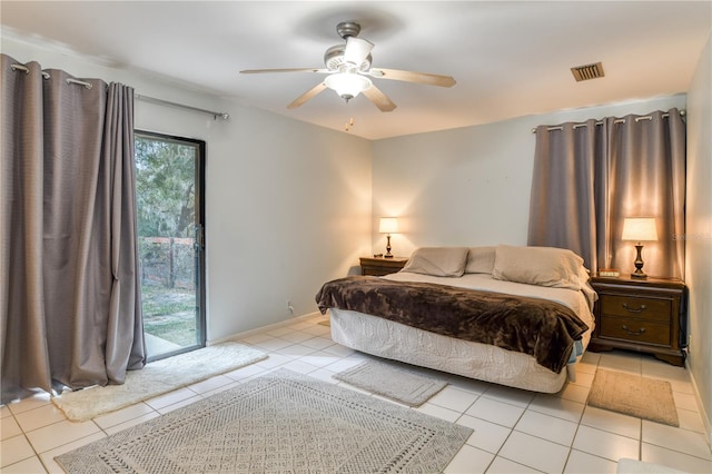 tiled bedroom featuring ceiling fan and access to outside