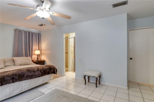 bedroom featuring connected bathroom, ceiling fan, and light tile patterned floors