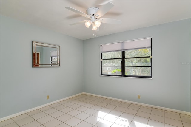 unfurnished room with ceiling fan and light tile patterned flooring