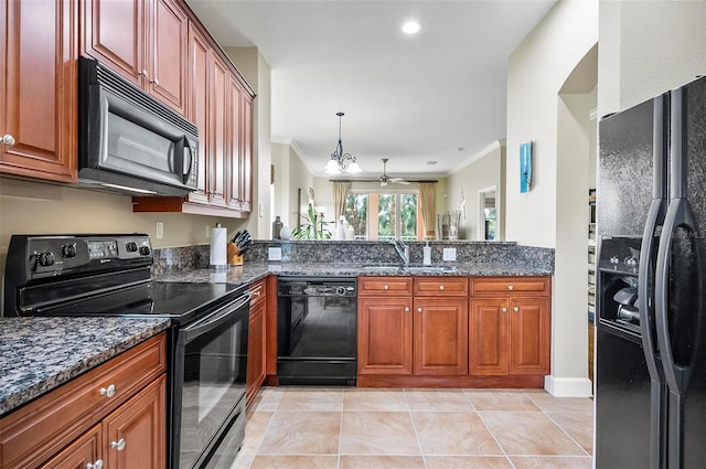 kitchen with black appliances, ornamental molding, sink, and dark stone counters