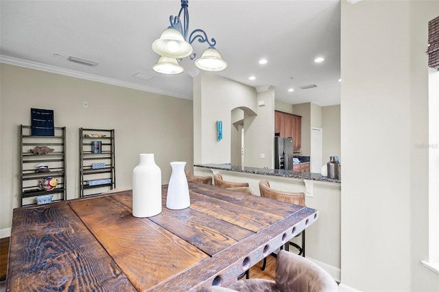 dining area featuring ornamental molding, recessed lighting, a chandelier, and visible vents