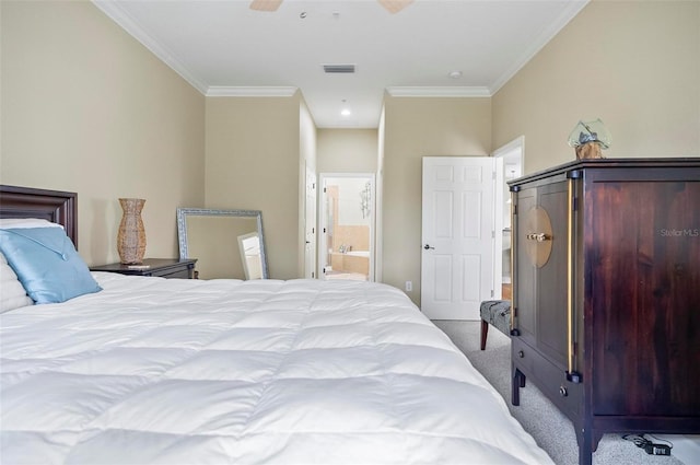 carpeted bedroom featuring ensuite bath, ceiling fan, and ornamental molding