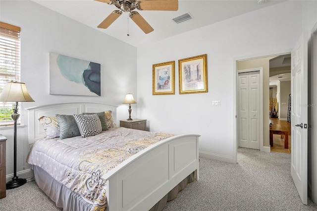 bedroom featuring ceiling fan and light carpet