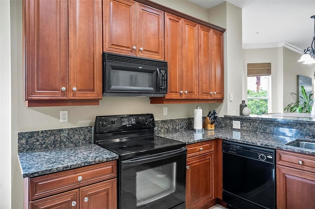 kitchen featuring hanging light fixtures, an inviting chandelier, dark stone countertops, black appliances, and ornamental molding