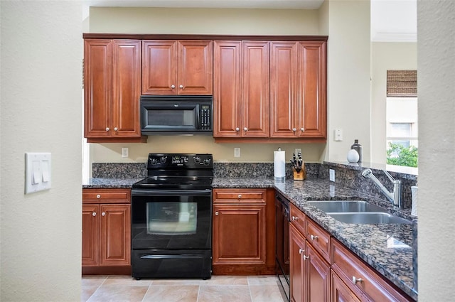 kitchen with black appliances, sink, and dark stone counters