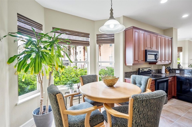 dining area with light tile patterned floors, a wealth of natural light, and recessed lighting