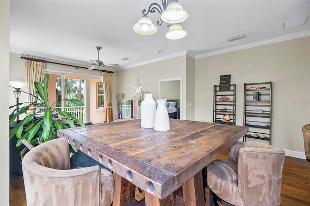 dining room featuring ceiling fan, ornamental molding, and dark wood-type flooring