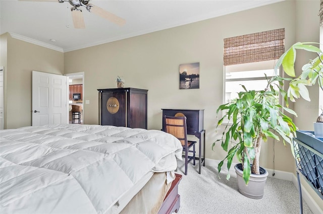 bedroom with ceiling fan, ornamental molding, carpet flooring, and baseboards