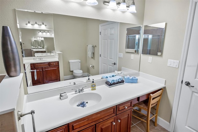 full bathroom featuring toilet, an enclosed shower, and vanity