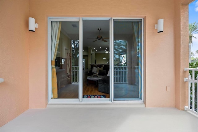 property entrance with stucco siding