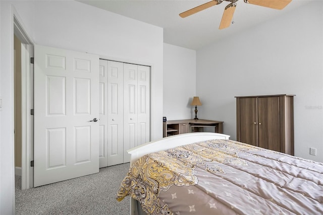 carpeted bedroom with ceiling fan and a closet