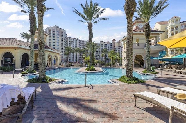 community pool featuring a patio area