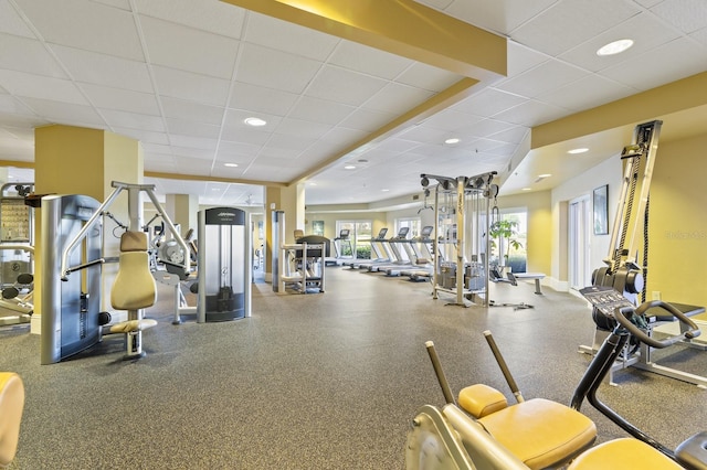 exercise room featuring a drop ceiling and recessed lighting