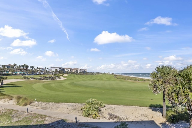 surrounding community with a water view and golf course view