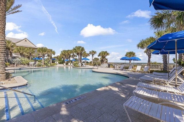 community pool with a patio area