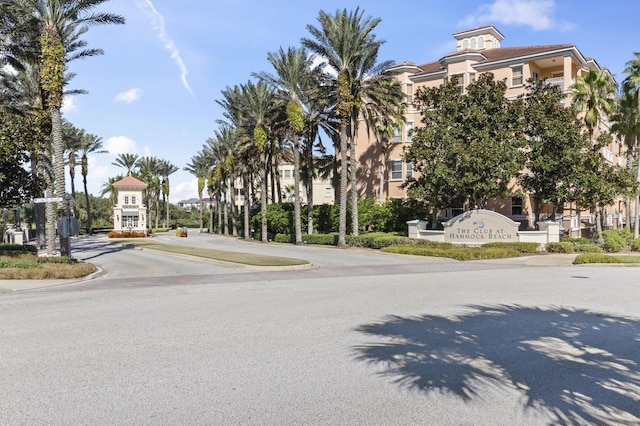 view of road featuring sidewalks, street lighting, and curbs