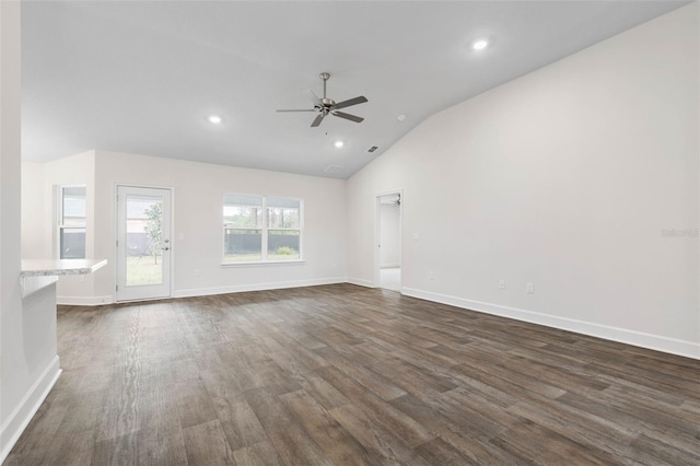 unfurnished living room with dark wood finished floors, baseboards, a ceiling fan, and lofted ceiling