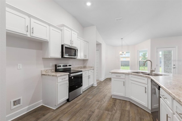 kitchen featuring baseboards, stainless steel appliances, dark wood-style floors, white cabinetry, and a sink