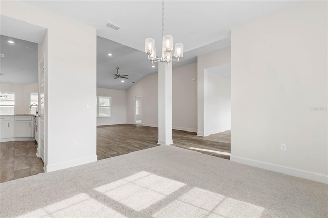 interior space with visible vents, baseboards, vaulted ceiling, recessed lighting, and wood finished floors