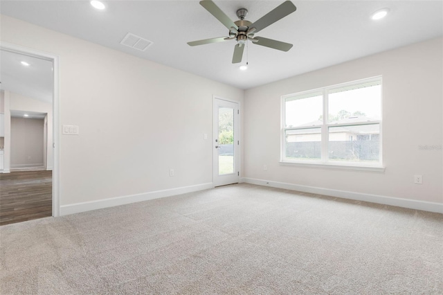 carpeted empty room with visible vents, recessed lighting, baseboards, and ceiling fan