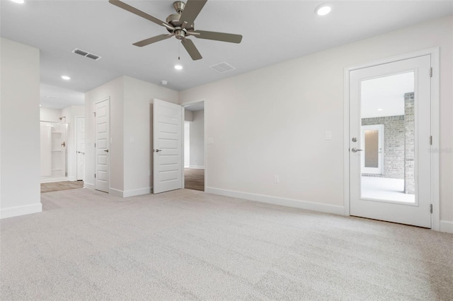 interior space with recessed lighting, visible vents, light carpet, and connected bathroom