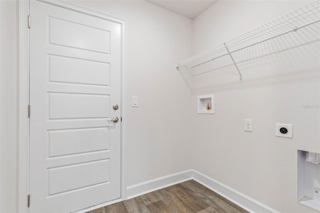 washroom with dark wood-type flooring, baseboards, laundry area, hookup for a washing machine, and hookup for an electric dryer