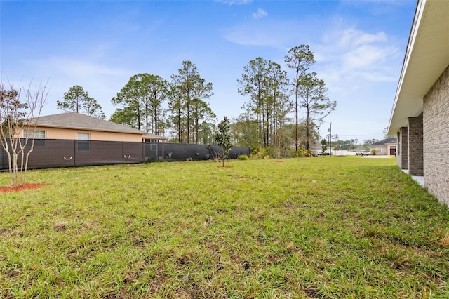 view of yard with fence