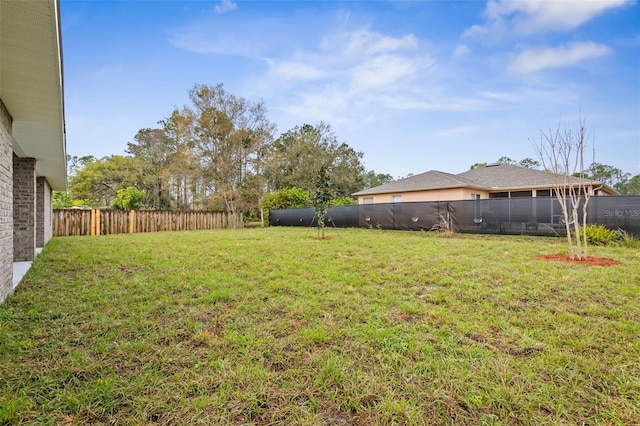 view of yard featuring a fenced backyard