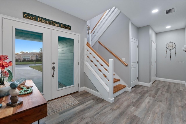 foyer entrance with light hardwood / wood-style flooring