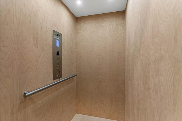 details with elevator and wooden walls