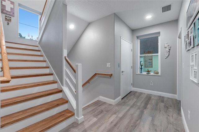 foyer entrance with light wood-type flooring