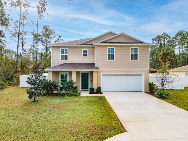 view of front of home with a front yard and a garage