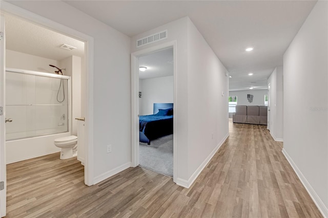 hall with light hardwood / wood-style flooring