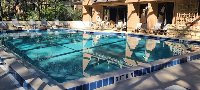 view of pool featuring a patio