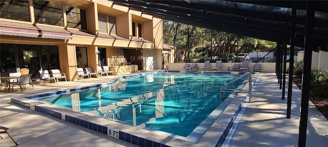 view of pool featuring a lanai and a patio area