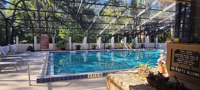 view of pool featuring a patio area and a lanai