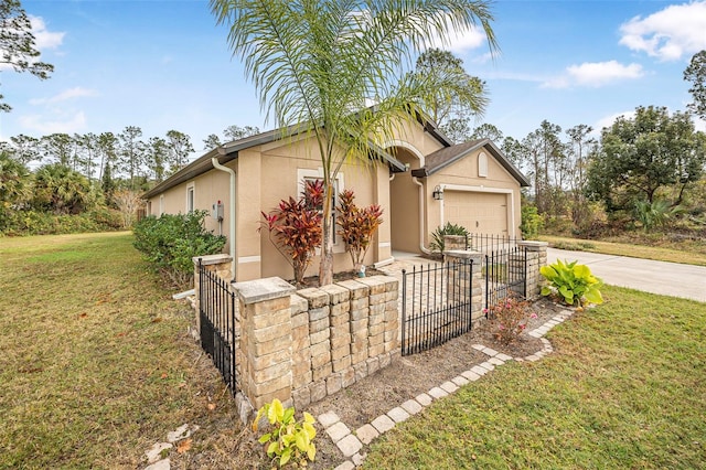 single story home with a garage and a front yard