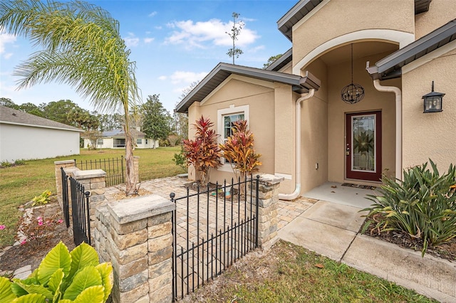 entrance to property with a yard