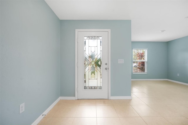 entryway featuring light tile patterned floors