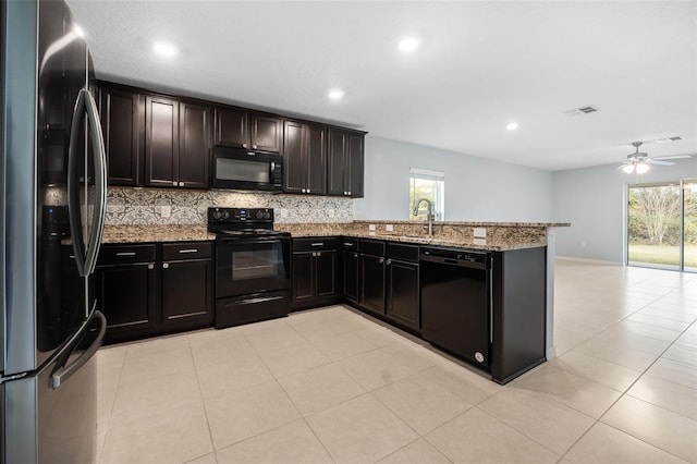 kitchen featuring black appliances, ceiling fan, kitchen peninsula, and a wealth of natural light