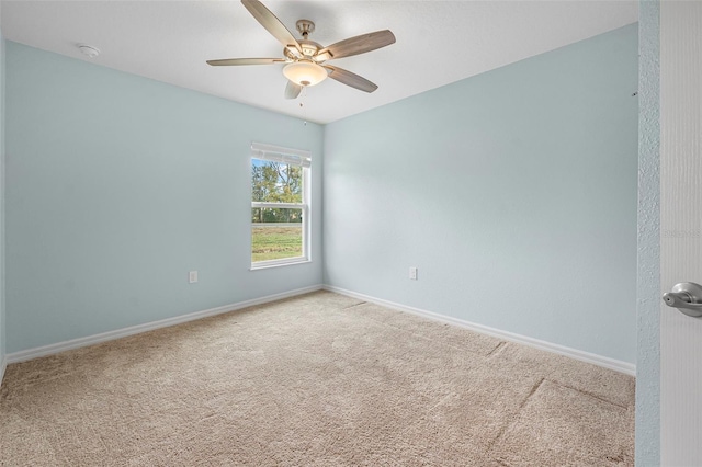 empty room with carpet flooring and ceiling fan