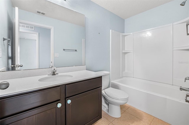 full bathroom with tile patterned floors, a textured ceiling,  shower combination, toilet, and vanity