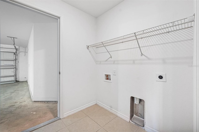 laundry area featuring hookup for a washing machine, light tile patterned flooring, and hookup for an electric dryer