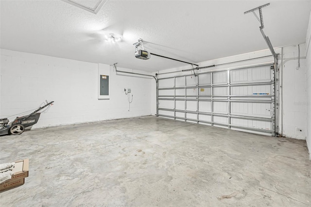 garage featuring electric panel and a garage door opener