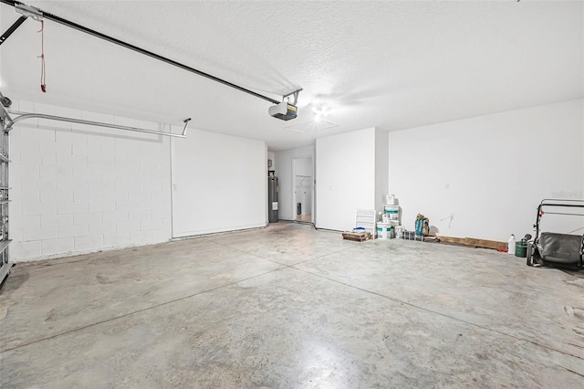 garage featuring a garage door opener and water heater