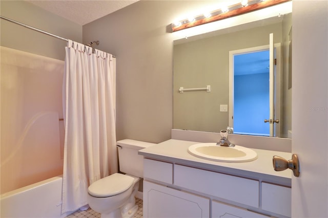 full bathroom with shower / bath combo, tile patterned floors, a textured ceiling, toilet, and vanity