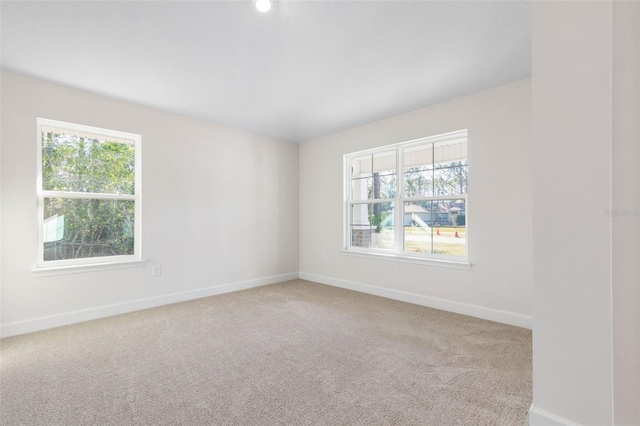 empty room with light colored carpet