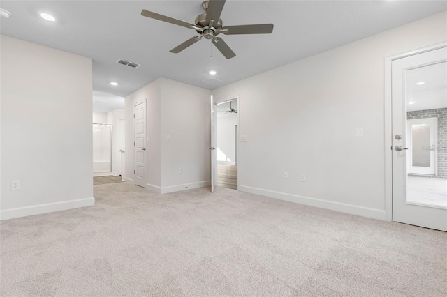 carpeted spare room with ceiling fan