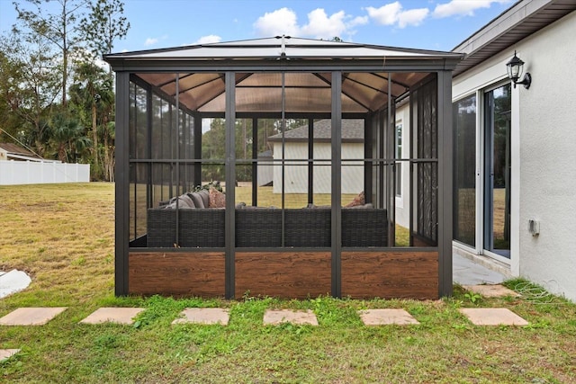 exterior space featuring outdoor lounge area and a lawn