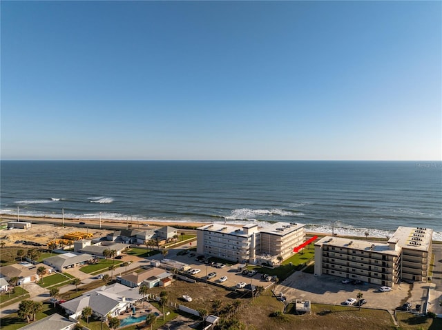 birds eye view of property featuring a water view and a view of the beach